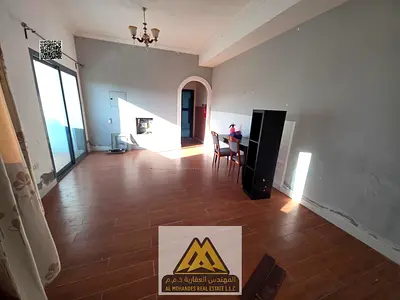 Large studio in Al Nuaimiya 1 with balcony, semi-separate kitchen, and central AC. AED 17K yearly, 4 payments, near Union Street, modern building, rea