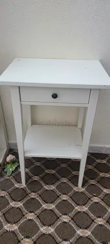 Small white bedside table with drawer and shelf