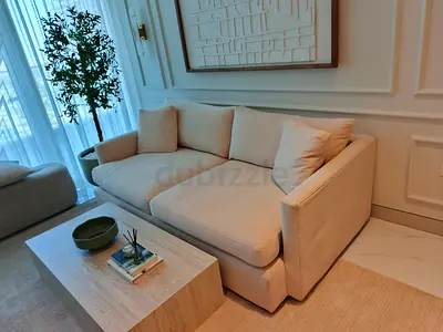 Crate and Barrel beige color sofa