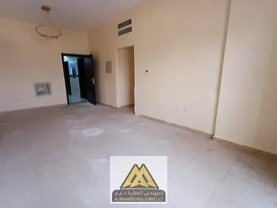 For rent 1BR apt Rashidiya 2 second tenant central AC free maintenance family building 26k 4 payments near Falcon Tower Qasr Al Hakim prime location