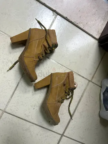 Pair of tan suede high-heel ankle boots, size unknown