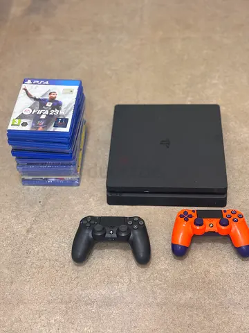 PlayStation 4 Slim with 2 Controllers and Game Stack