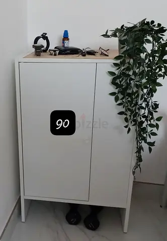 White two-door storage cabinet - good condition