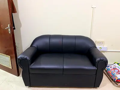 Compact 2-Seater Black Faux Leather Sofa - Good Condition