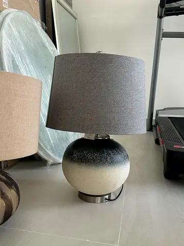 Modern grey fabric table lamp with spherical ceramic base