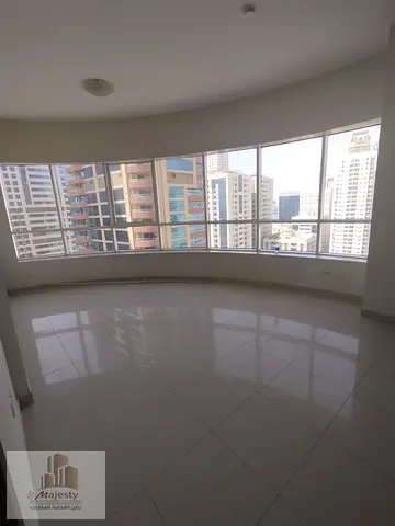 For rent: a 3-bedroom apartment with a living room and a master maid's room in the Al Khan area of Sharjah.