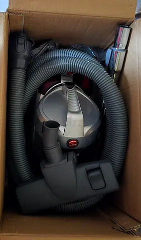 Hoover canister vacuum with hose and attachments - good condition