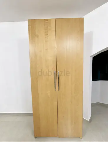 Two-door light wood wardrobe / armoire in good condition