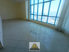 A great annual rental opportunity for a 2-bedroom apartment with a panoramic sea view on Ajman Corni
