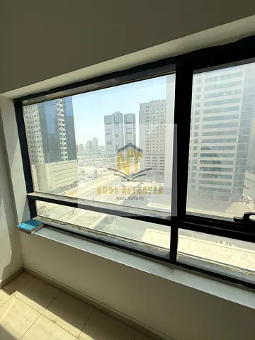An apartment for annual rent in the Al Taawun area of ​​Sharjah, boasting a prime location close to various essential services and amenities, making i