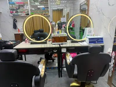 Salon styling station with two chairs and illuminated mirrors - ready to use