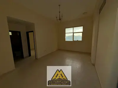 2-bedroom apartment with living room in Al Jurf 2, Ajman, 2 bathrooms, central AC, spacious layout, AED 35,000 in 4 installments, next to Sheikh Ammar