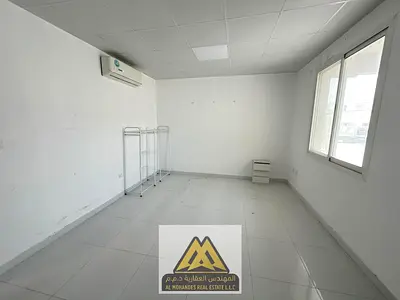 Studio in Liwara 1, Ajman. Very spacious, separate kitchen, split AC, ground floor, clean building, maintenance covered by owner. AED 18,000 in 4 inst