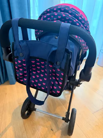 Lightweight navy stroller for dolls with pink heart pattern