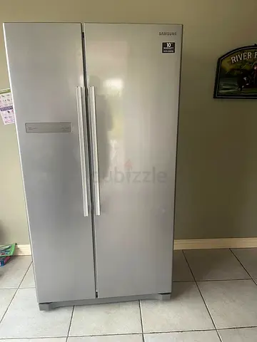 Samsung side by side refrigerators like new condition