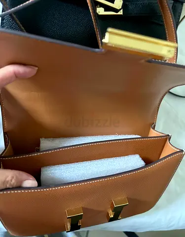 Brown leather shoulder bag with gold hardware