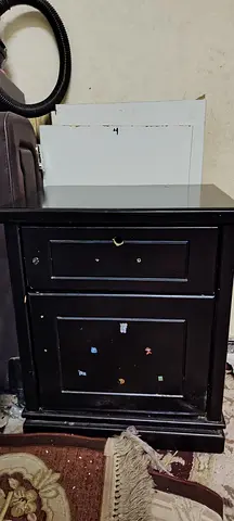 Used black wooden bedside cabinet with drawer and storage cupboard
