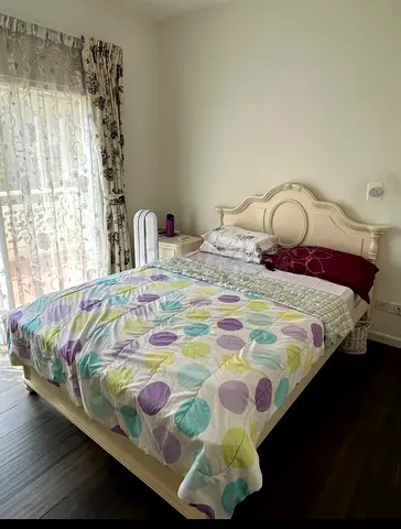 Solid wood double bed with carved headboard - good condition