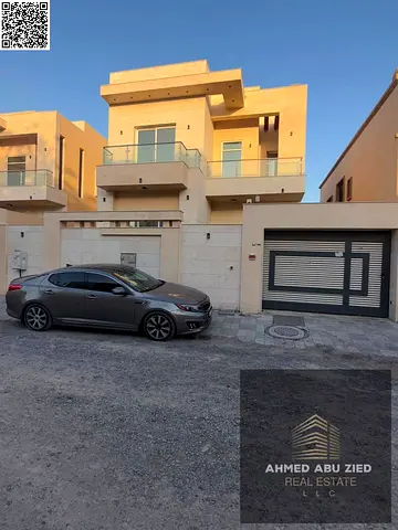 Villa for rent in Al Muwaihat 3, 5 master BR, a majlis, 3 living rooms, a maid's room, a kitchenette, 2 balconies, a carport, and spacious front yard.