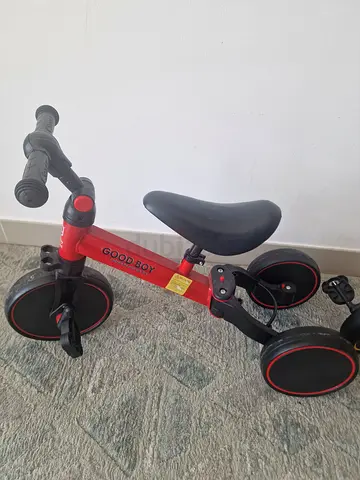 Red toddler tricycle / ride-on bike in good condition