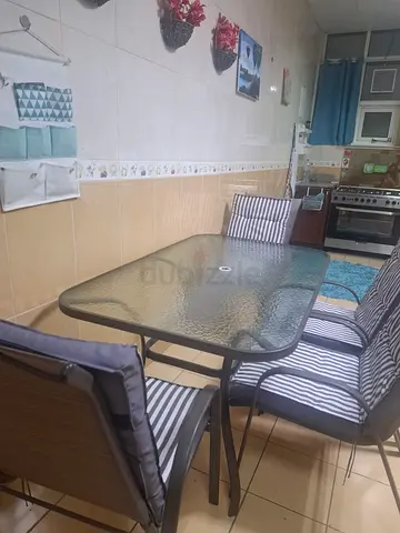 Outdoor table with 4 chair set with umbrella and cushions