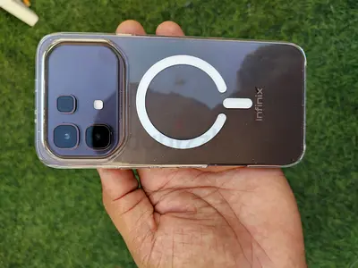 Used smartphone with USB-C port and clear bumper case - good working condition