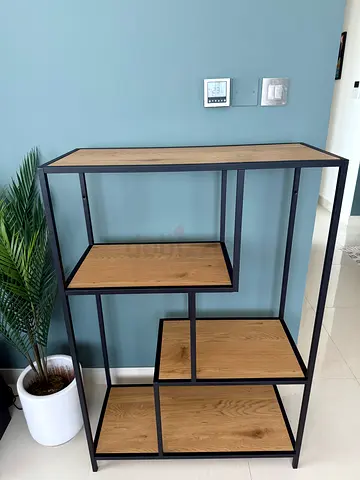 Industrial-style wooden shelving unit with metal frame