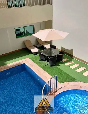 Investment Studio Apartment for Sale in Smart Towers Al Amerah Ajman with Pool and Balcony