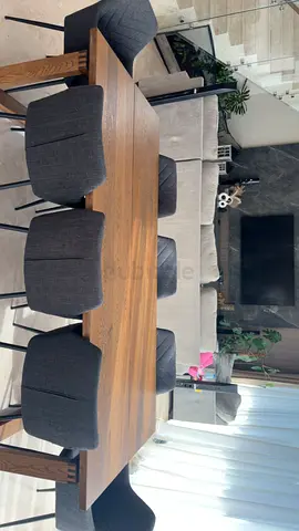 Wooden dining table with 8 upholstered chairs - good condition