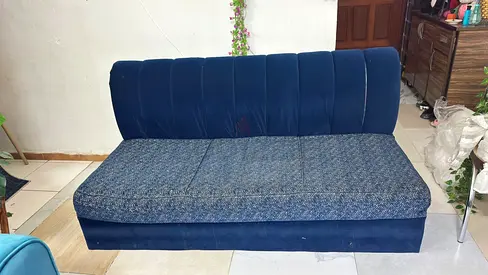Comfortable blue three-seater sofa