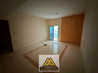 A one-bedroom apartment in a prime location on Sheikh Khalifa Street, featuring a practical layout, two balconies, built-in wardrobes, and central ai