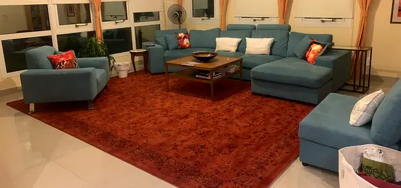 Large L-shaped light blue fabric sofa with chaise and armchair - good condition