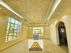 A luxurious villa with exceptional spaces, a spacious yard, a separate majlis, and two living rooms