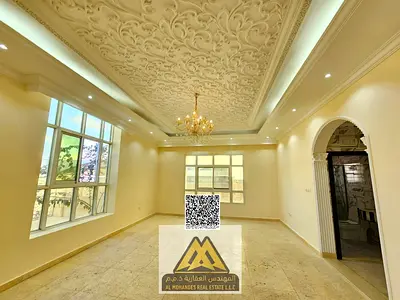 A luxurious villa with exceptional spaces, a spacious yard, a separate majlis, and two living rooms in a prime location behind Nesto Al Muwaihat
