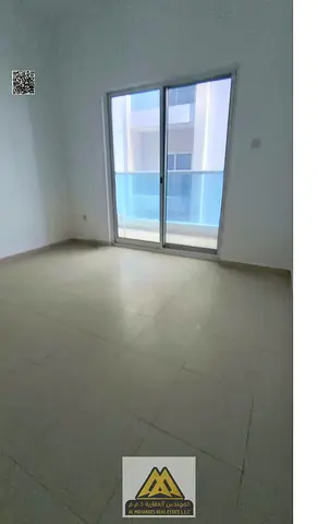 For rent: 1-bedroom apartment with hall in Al Nuaimiya 3, City Tower on Sheikh Khalifa Street, 2 bathrooms, balcony, central AC, free maintenance, AED