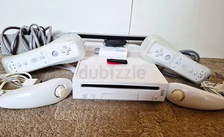 Nintendo Wii with all cables, 2 controllers and more than 50 games