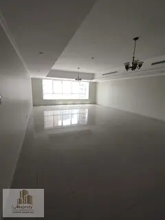 For rent: a 4-bedroom apartment with a large living room and a master maid's room in Sharjah Emi