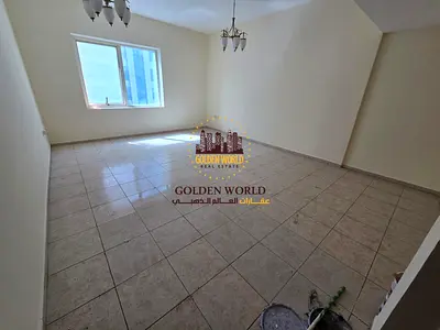 Al-Taawun: Spacious two-bedroom apartment with a living room, two bathrooms, and a balcony offering an open view; prime location close to all amenitie