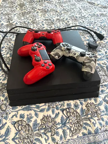 PlayStation 4 pro  with 3 DualShock 4 Controllers (Red  Camo) - Good Condition