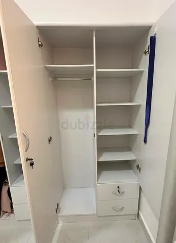 2 separate White 2-Door Wardrobe with Shelves and Drawers