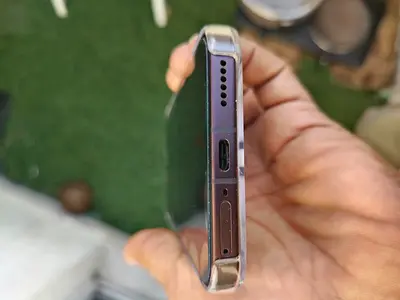 Used smartphone with USB-C port and clear bumper case - good working condition