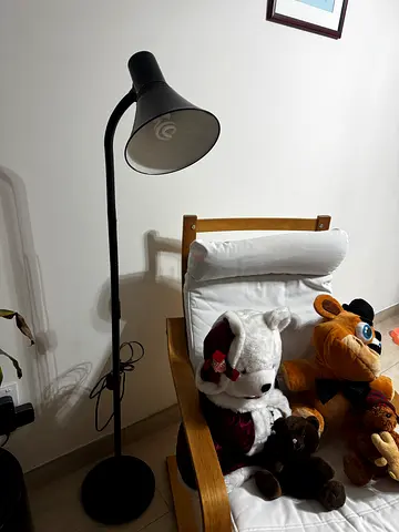 Black adjustable floor lamp in good working condition