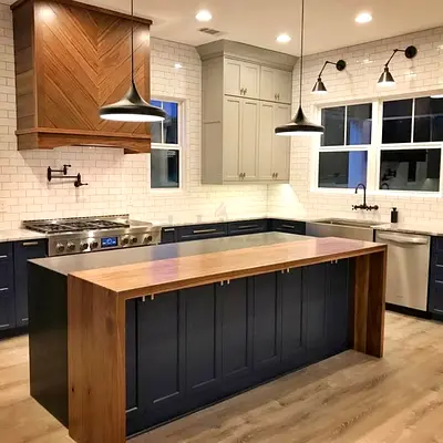 Modern wooden kitchen island with navy base and breakfast bar