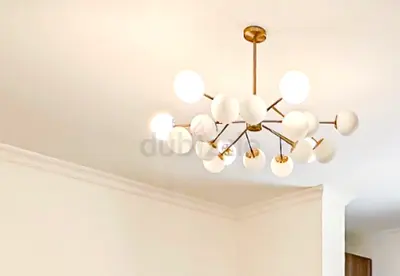 Modern brass multi-globe chandelier - 12 light ceiling fixture from West Elm