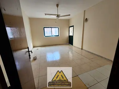 Lowest annual rent price, families only - 3-bedroom apartment with a spacious living room in Al Nakheel 1