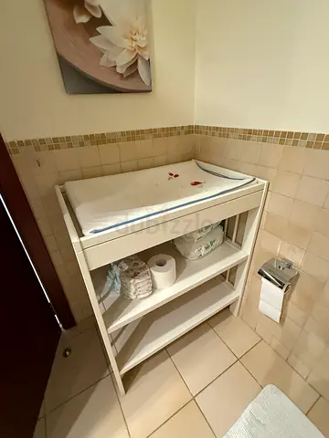 White baby changing table with open shelves — good condition with its mattress. Bought in IKEA