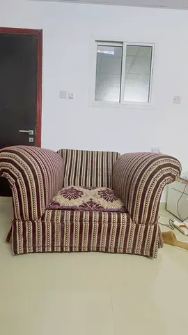 Large single-seater upholstered armchair in striped fabric