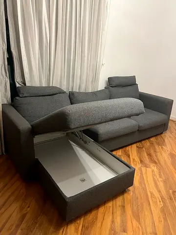 L-shaped grey fabric sofa bed with storage ottoman - Ikea