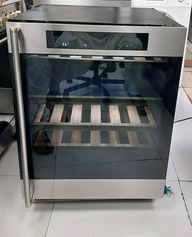 Under-counter wine cooler / beverage fridge in stainless steel — good condition