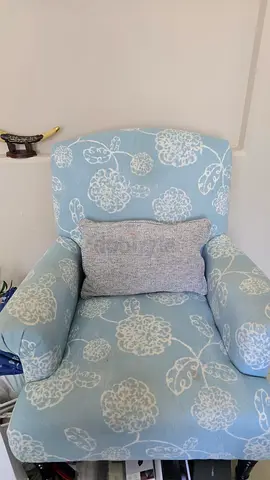 Light blue floral upholstered armchair with cushion - good condition